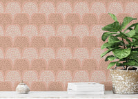 Textured arch pattern wallpaper behind a wooden office desk.