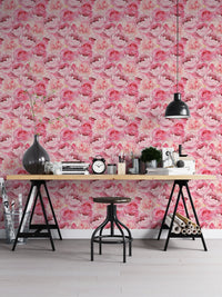 Pink peonies roses wallpaper on office wall with wooden desk and black trestle legs.