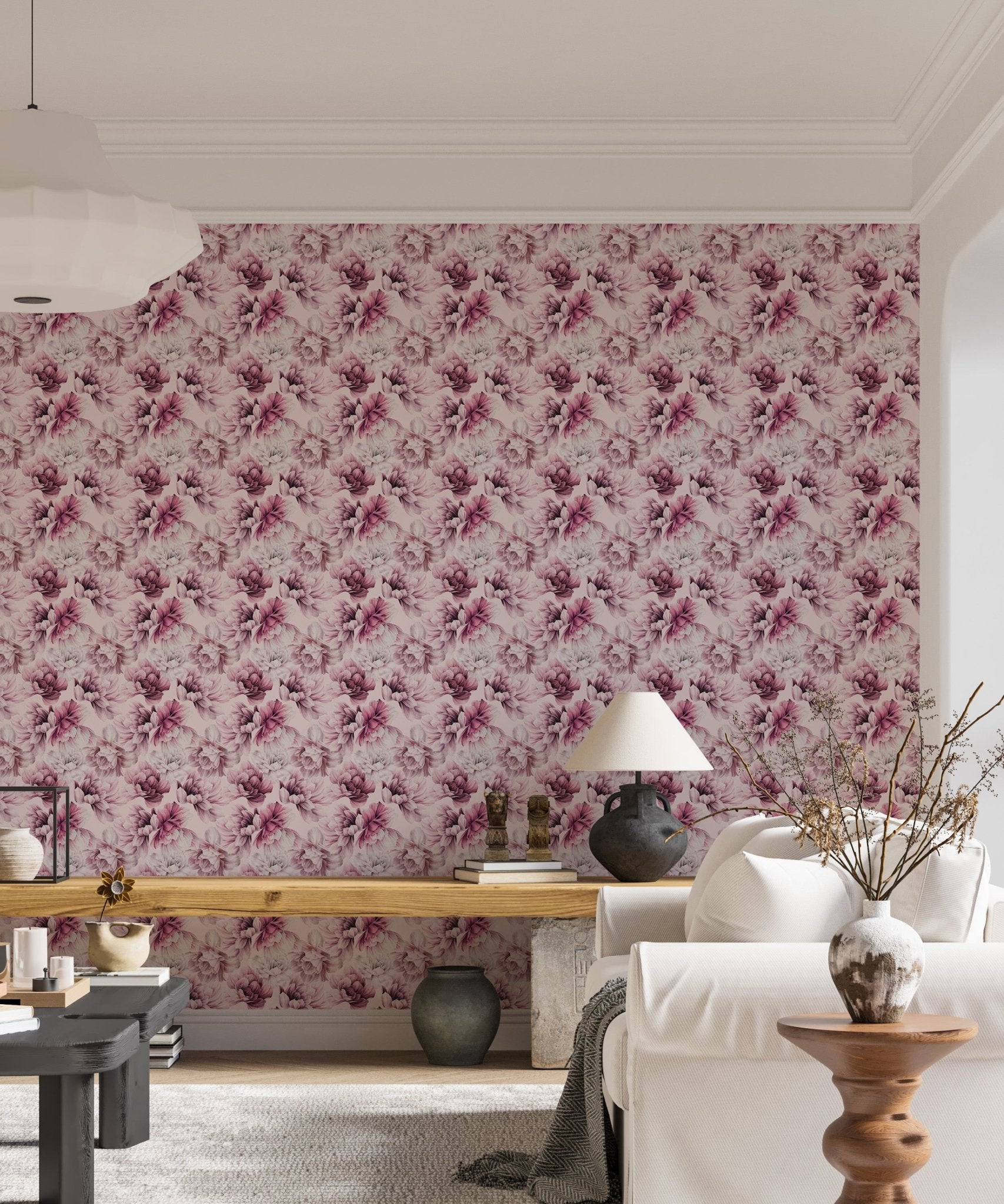 Living area with pink floral wallpaper and a wooden table setup.