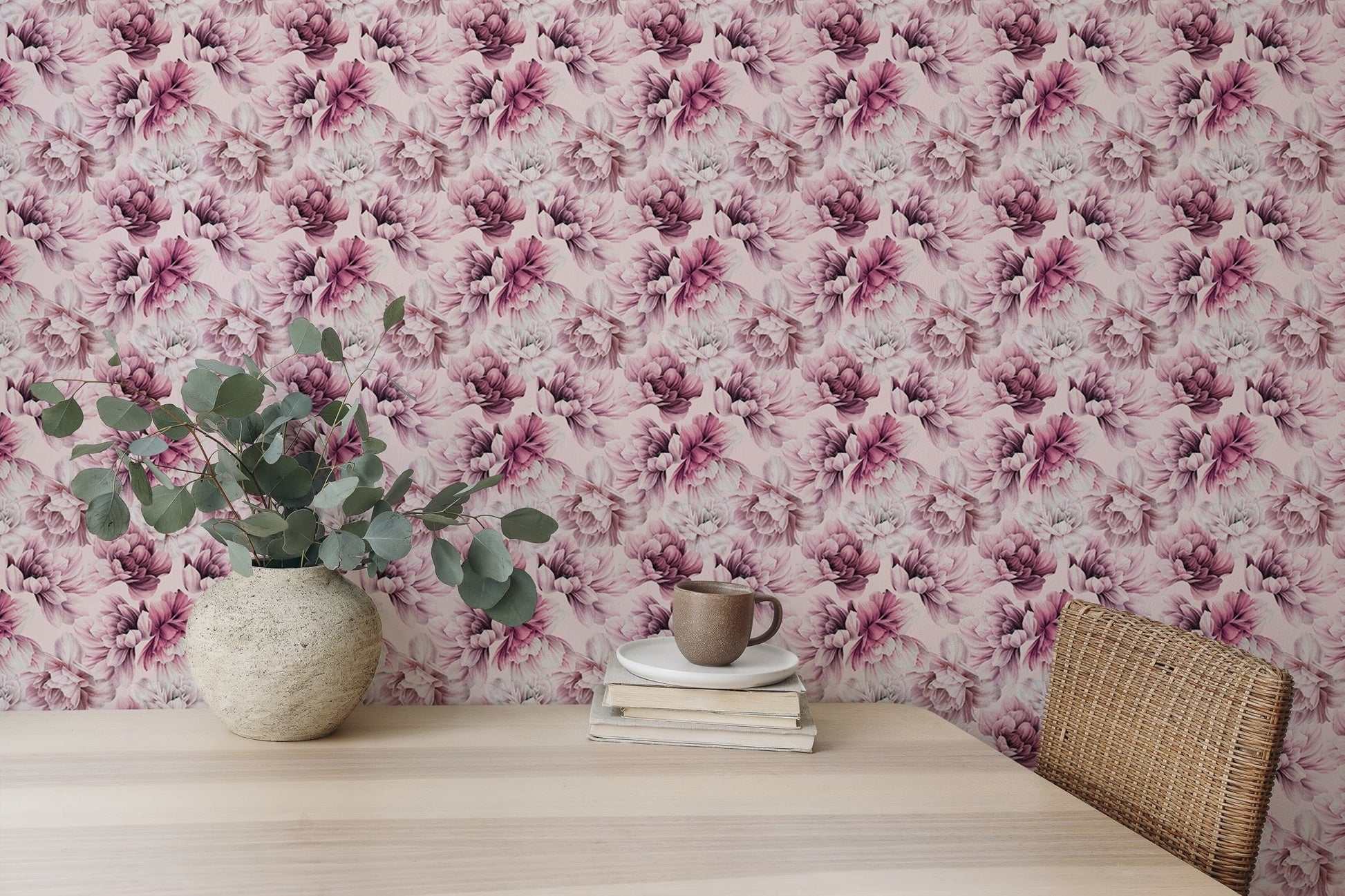Pink floral wallpaper used in a dining space with a light wood table.
