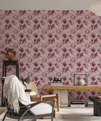 Living room with pink floral wallpaper and a dark accent chair.