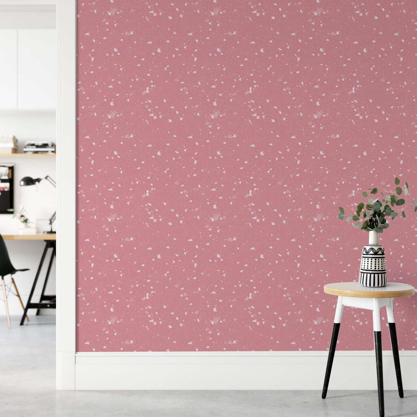 Pink Venetian Quartz Stone Terrazzo Peel and Stick Wallpaper in a hallway with a stool.