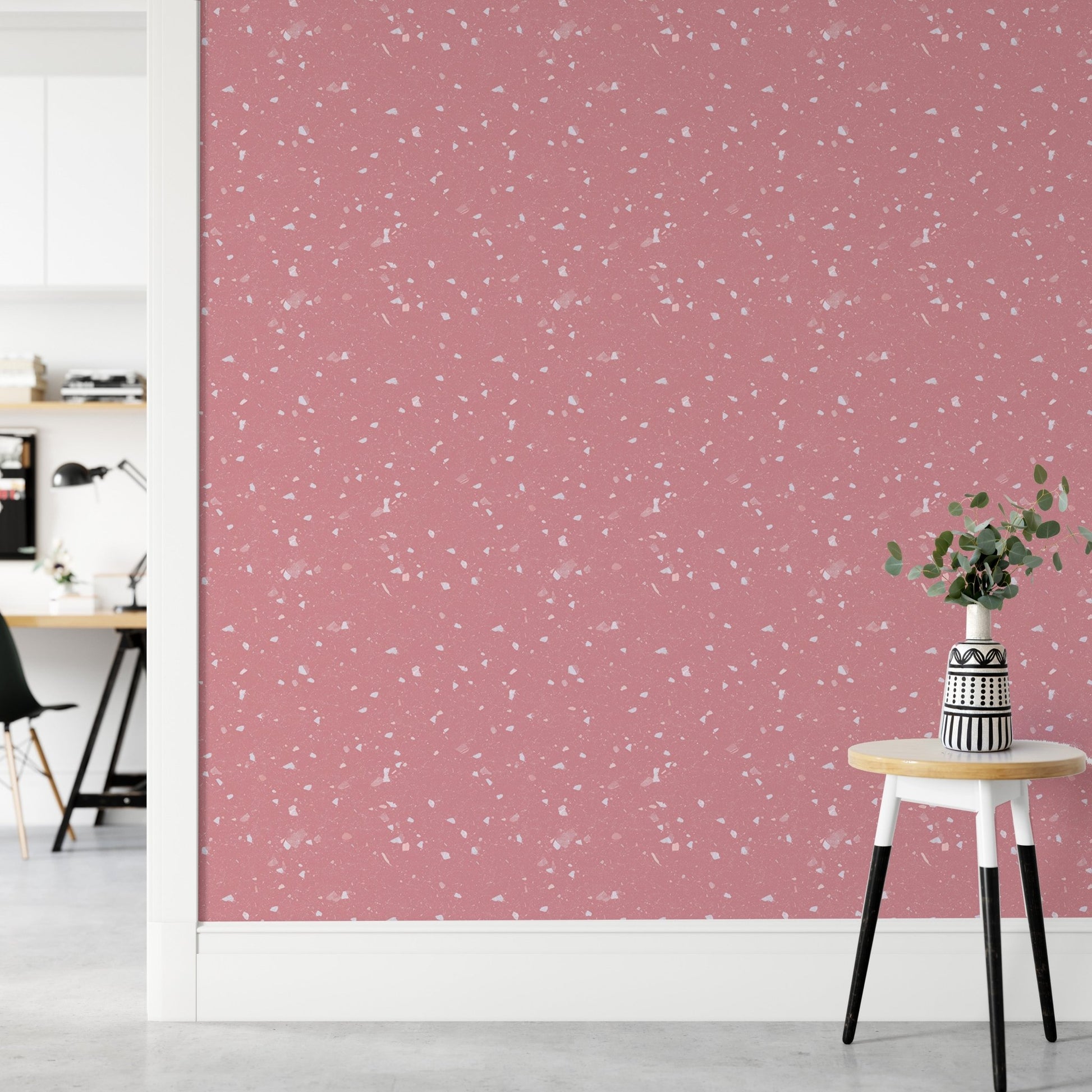 Pink Venetian Quartz Stone Terrazzo Peel and Stick Wallpaper in a hallway with a stool.