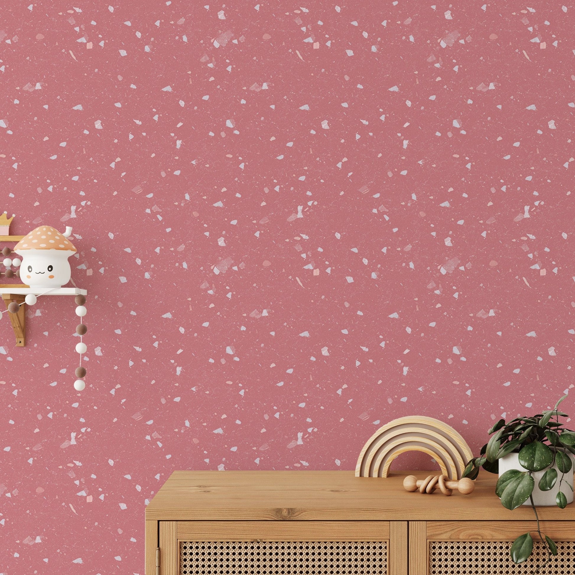 Children's room featuring pink stone pattern wallpaper and wooden furniture.