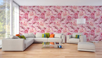 Large living room with pink floral wallpaper on the main wall.