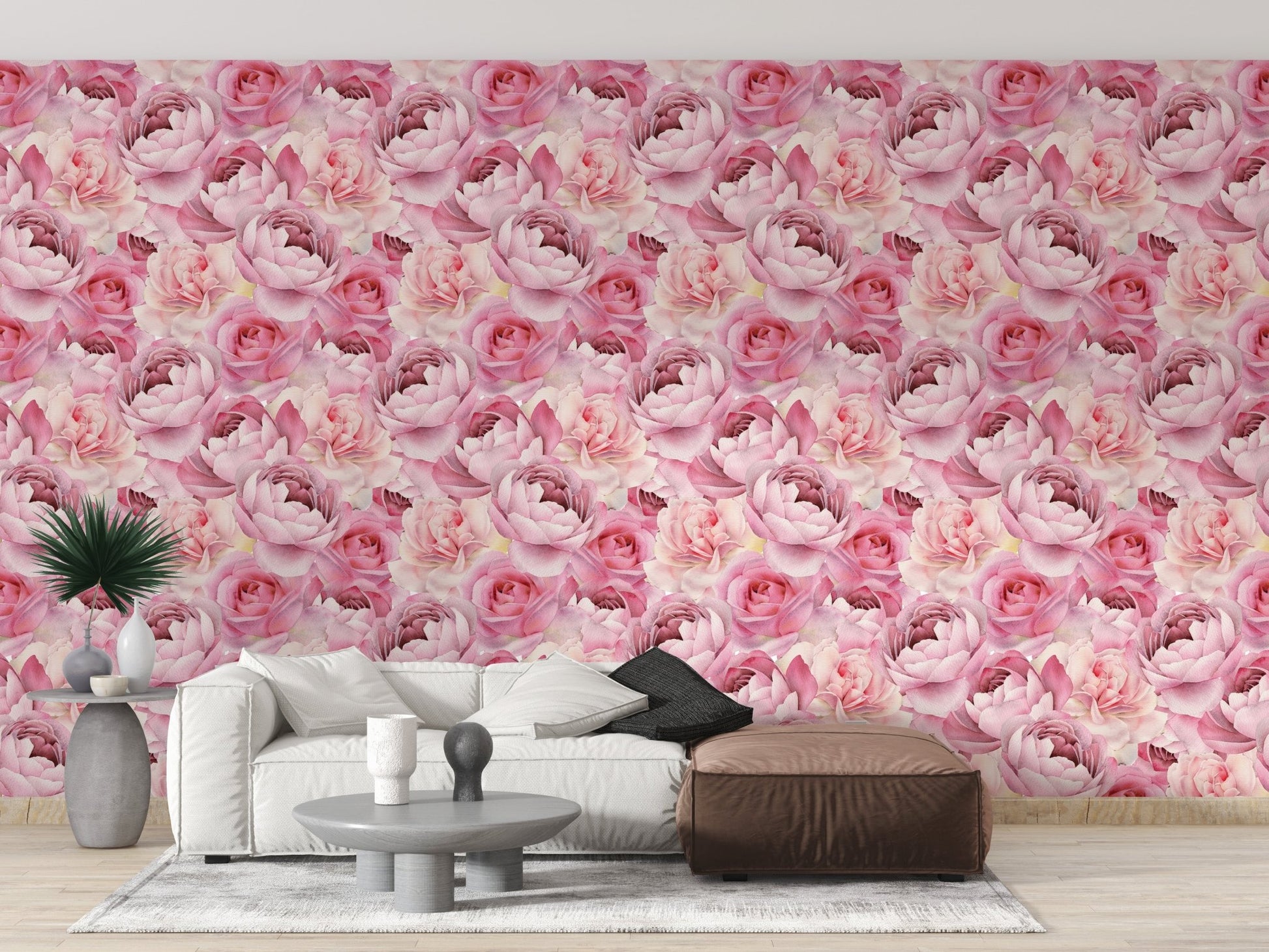 Modern sofa set placed against pink rose pattern wallpaper.