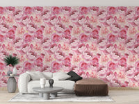 Modern sofa set placed against pink rose pattern wallpaper.