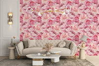 Cozy seating arrangement with vibrant pink rose wallpaper.
