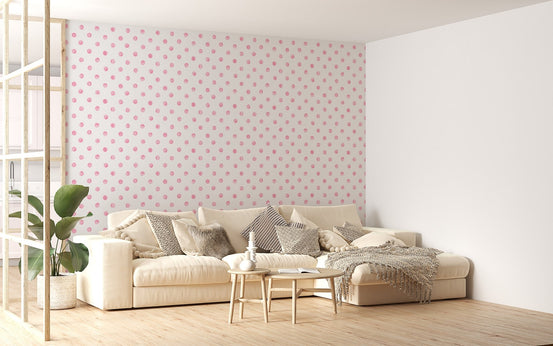 Pink watercolor seamless pattern polka dots wallpaper in a living room with white sofa.