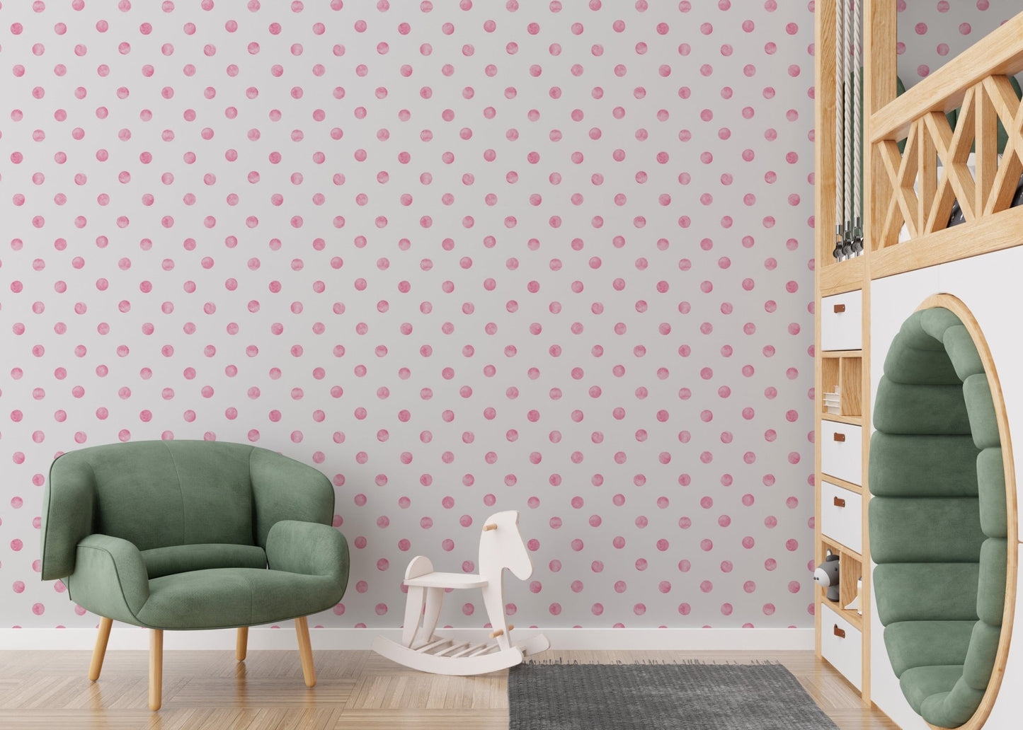 Nursery wallpaper with pink dots featuring a green armchair and toy horse.