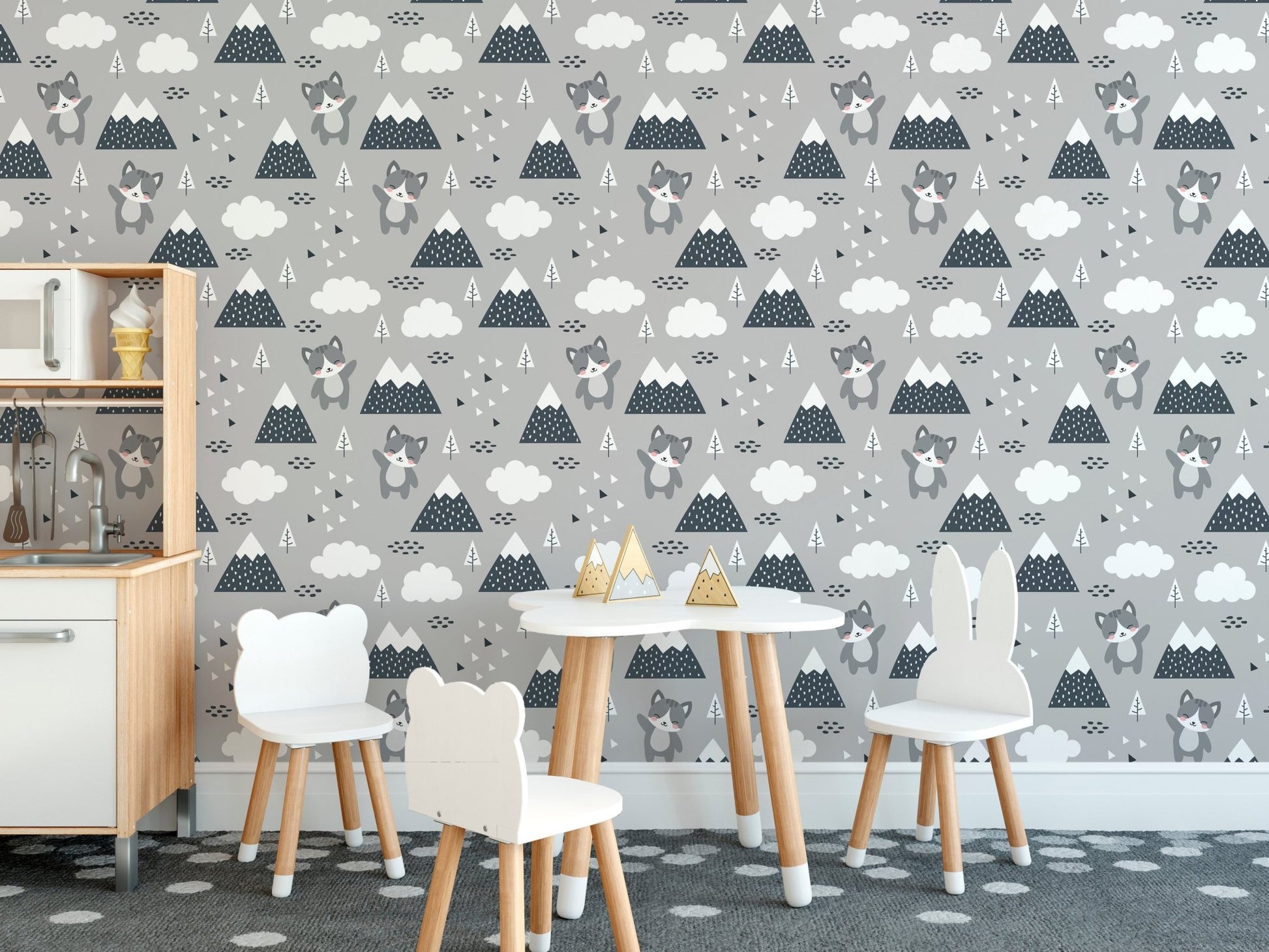 Scandinavian wall mural with cat graphics in dining room with chair and table.