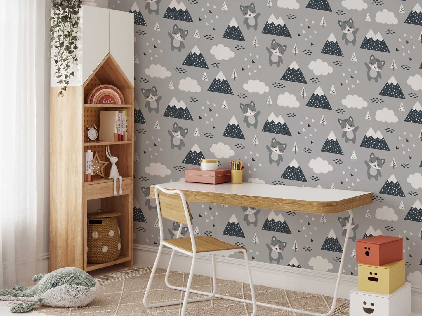 Wallpaper with kitten and cloud motifs in a study space with a desk