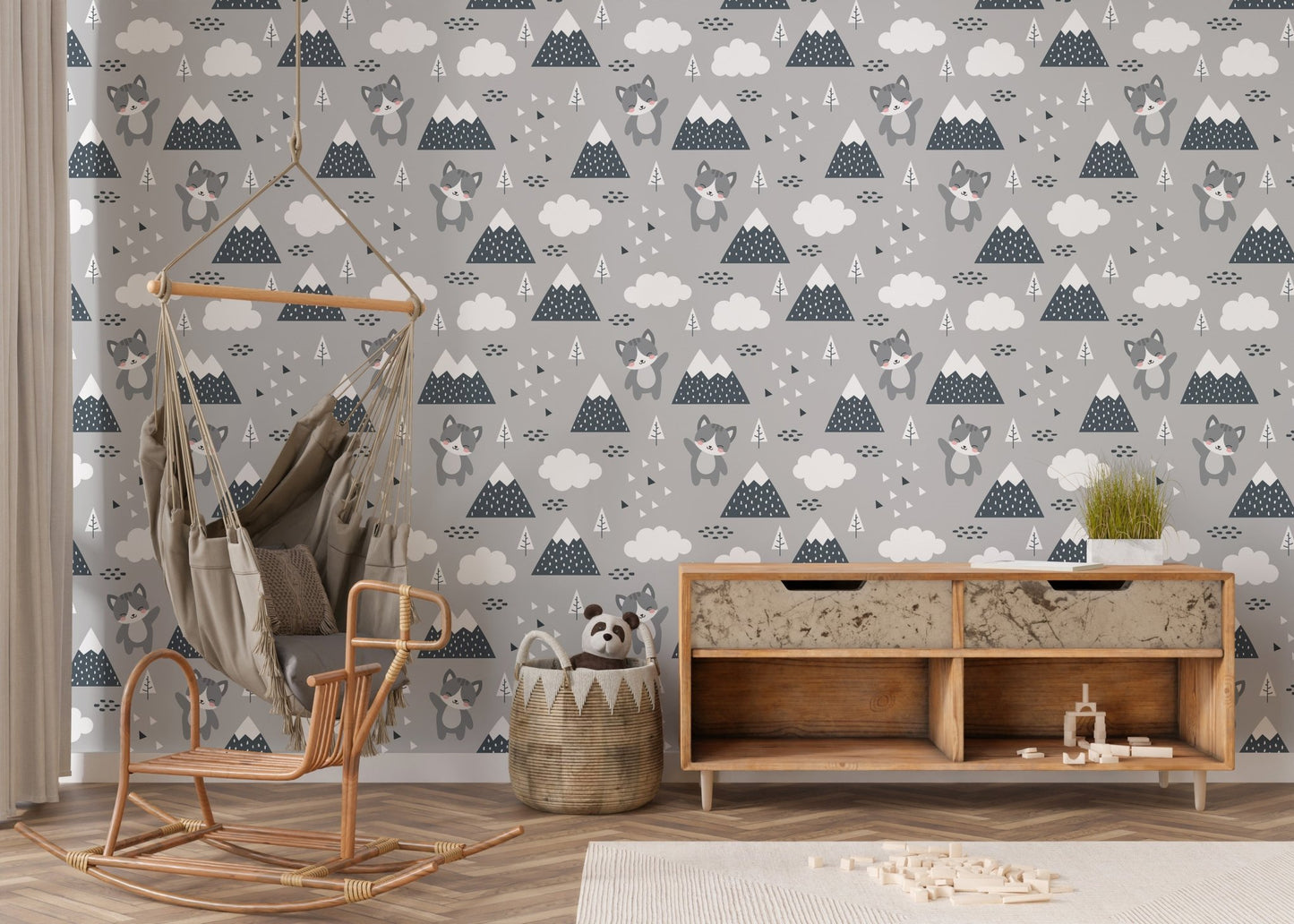 Neutral toned kitty wallpaper behind a wooden desk and chair setup