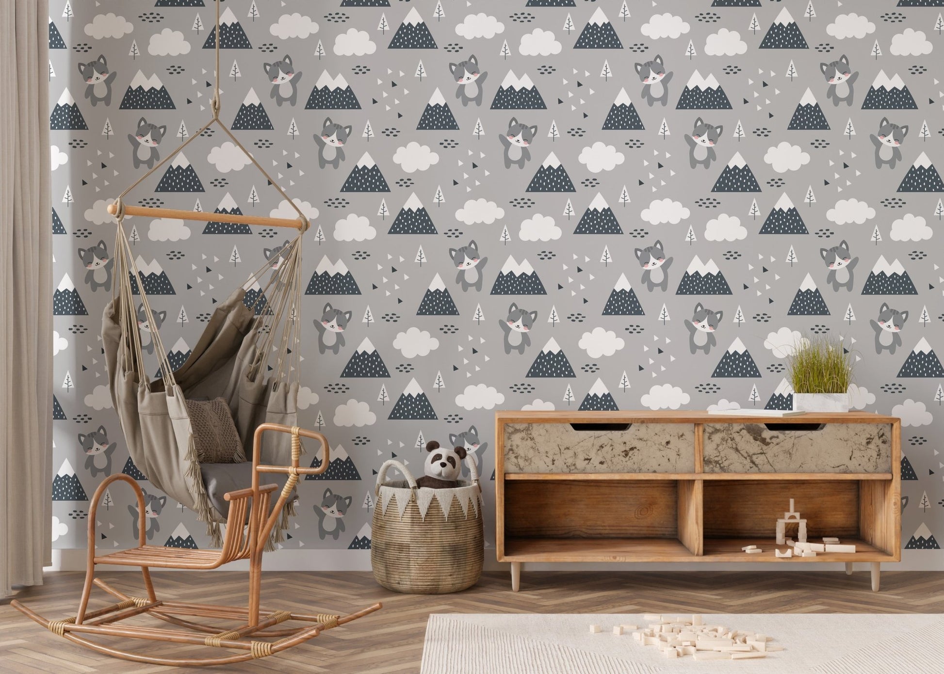 Neutral toned kitty wallpaper behind a wooden desk and chair setup