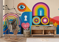 Artistic mural wallpaper in blue, orange, pink, and green tones.