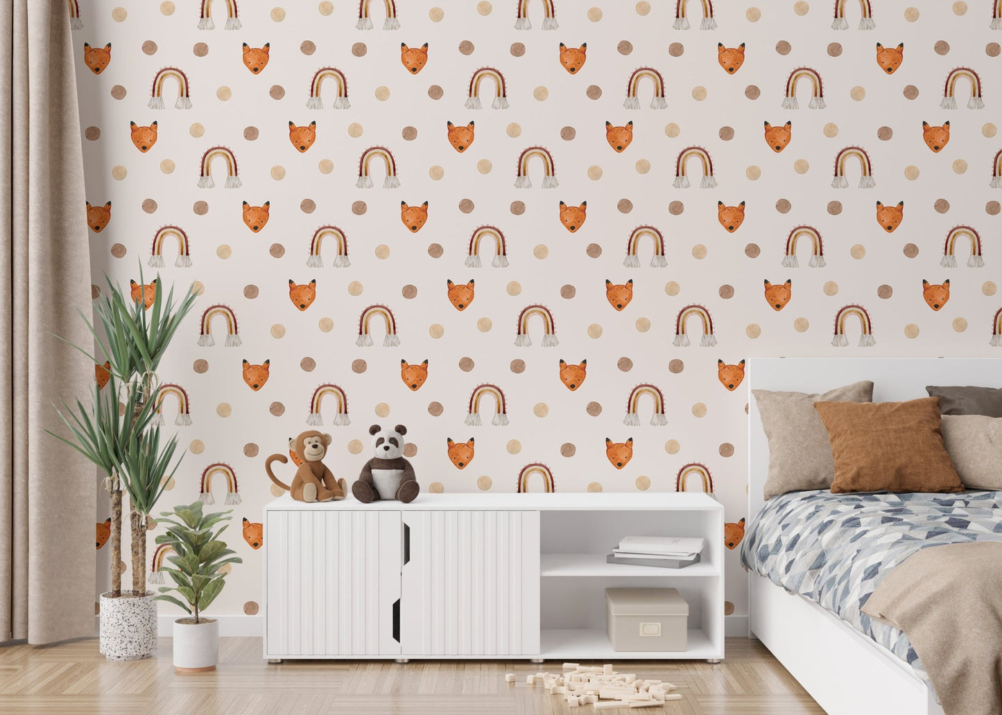 Kids room wallpaper with fox faces and rainbows behind a white storage cabinet.