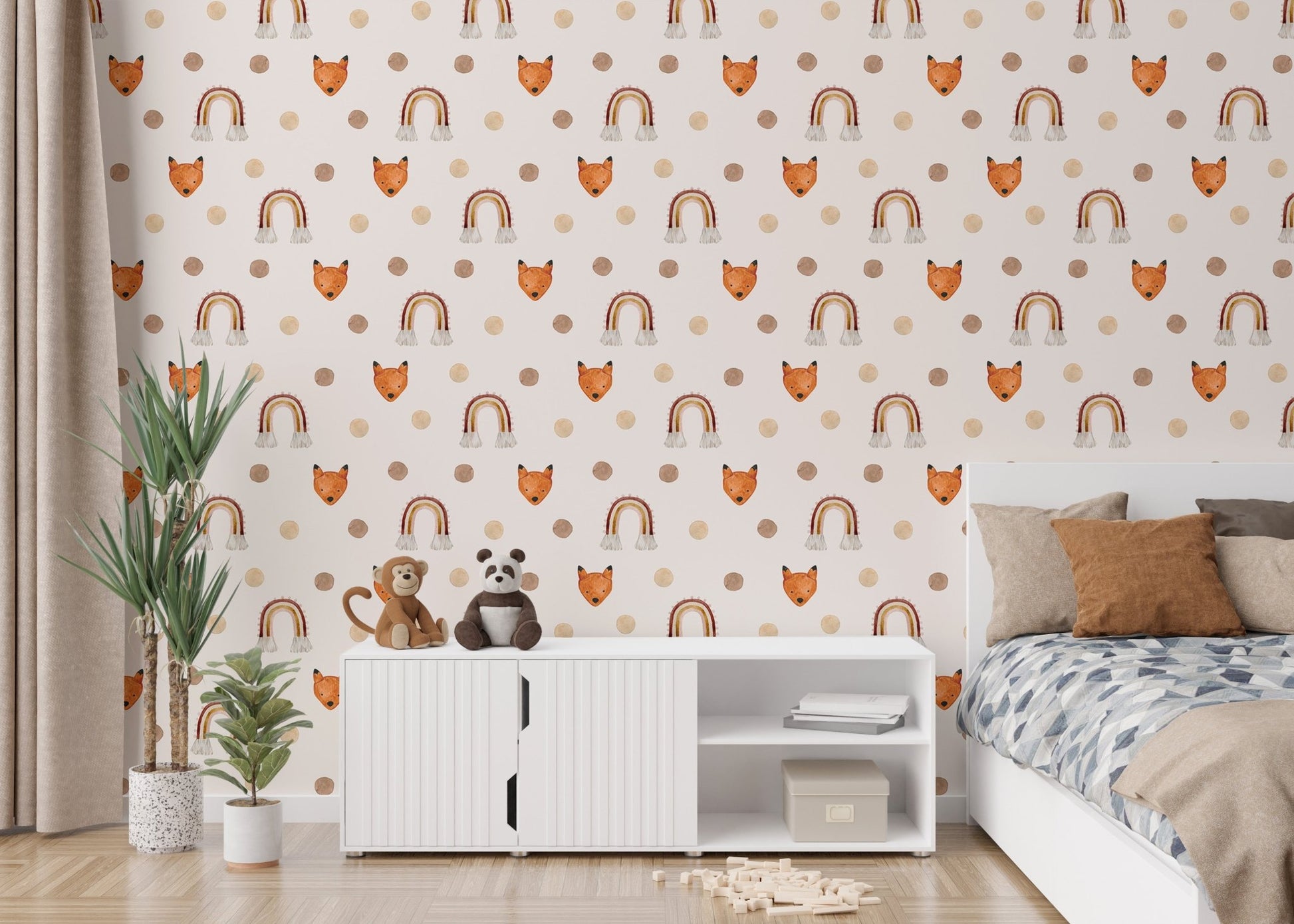 Kids room wallpaper with fox faces and rainbows behind a white storage cabinet.