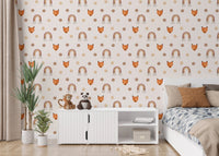 Kids room wallpaper with fox faces and rainbows behind a white storage cabinet.