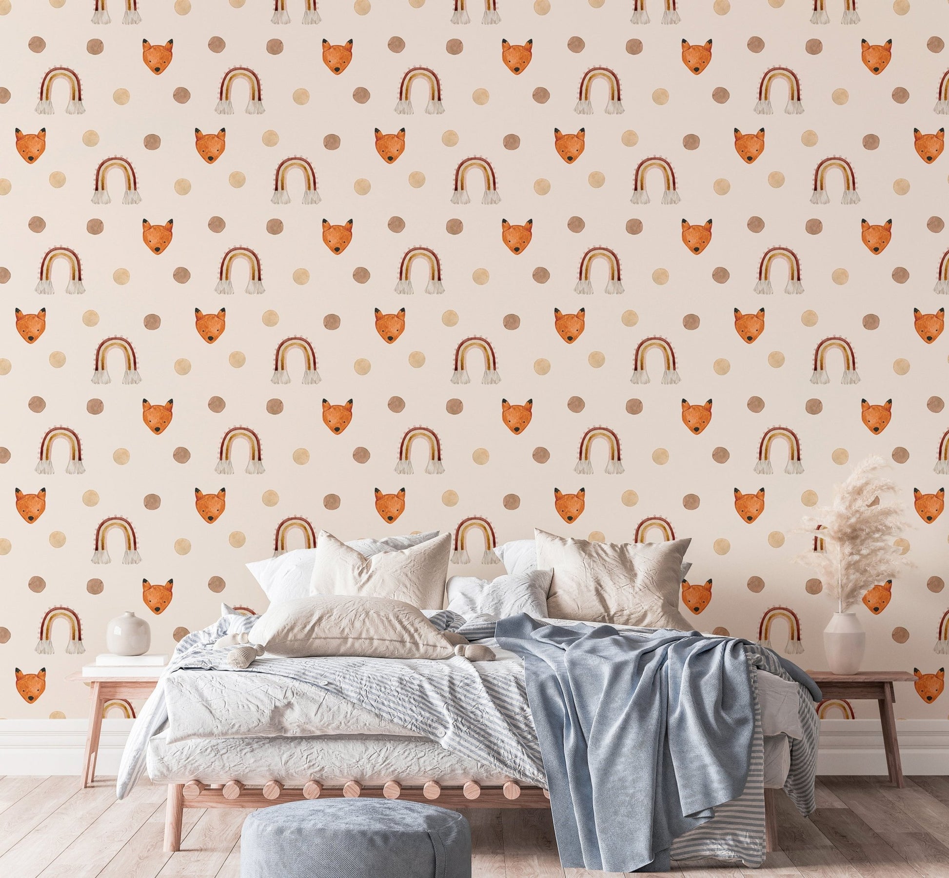 Minimalist kids room wallpaper with beige rainbows and orange foxes above a bed.