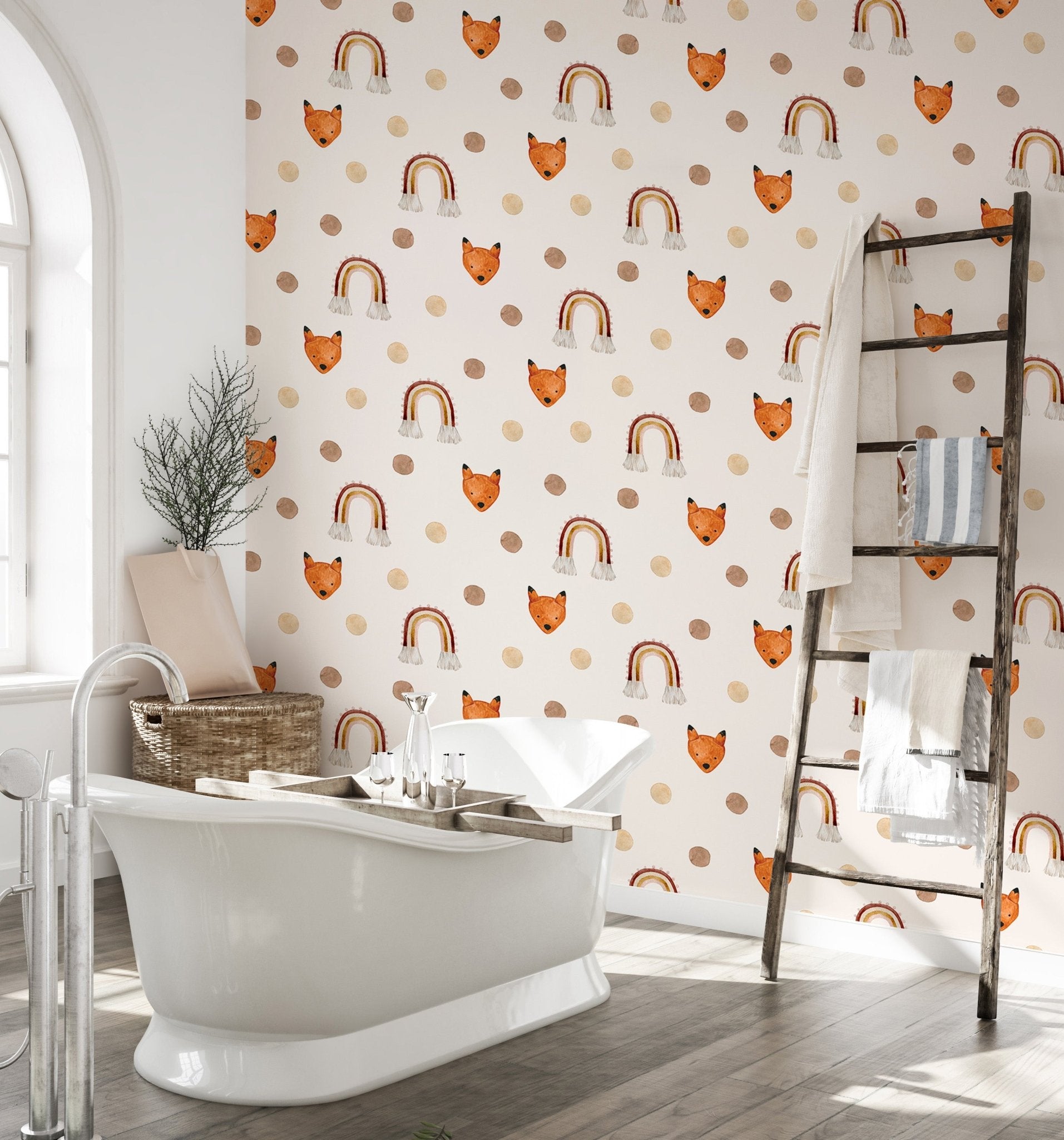 Polka dots and fox wallpaper used as a feature wall in a bathroom with a white tub.