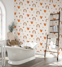 Polka dots and fox wallpaper used as a feature wall in a bathroom with a white tub.
