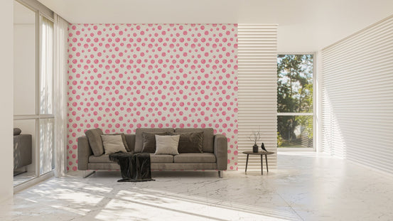 Large living space featuring a pink watercolor dots wallpaper and grey sofa.
