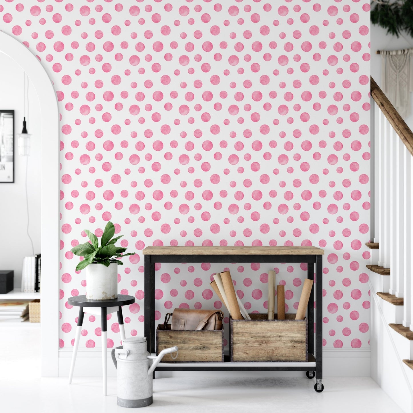 Pink patterned wallpaper in a hallway with a metal shelf and white watering can.