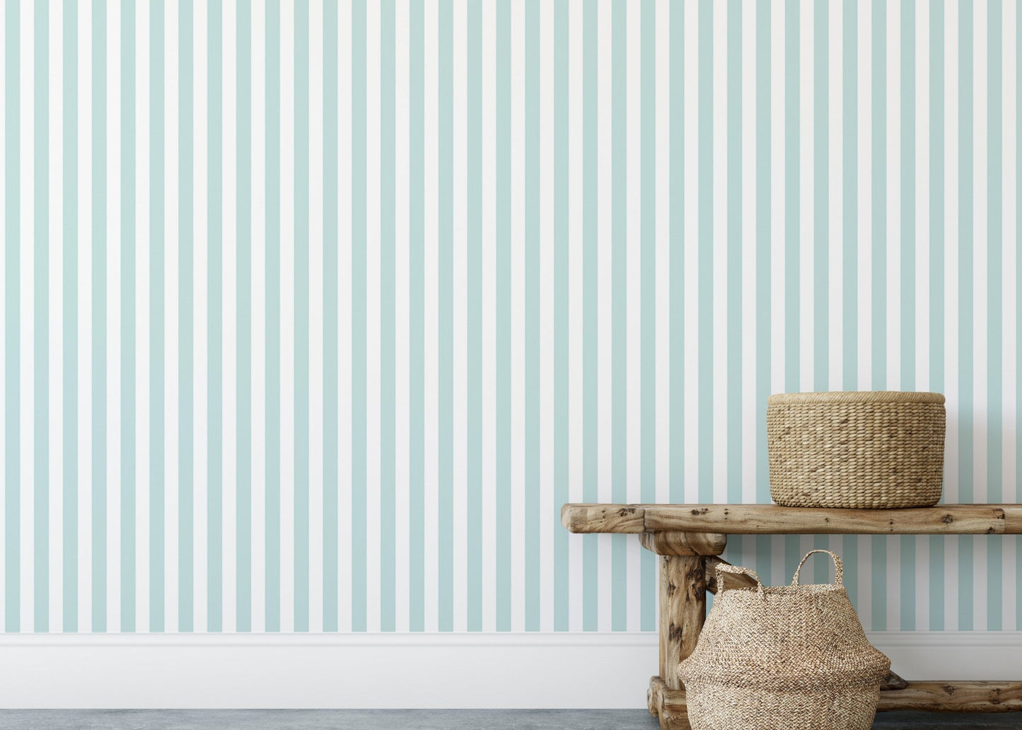 Textured baskets placed against a wide turquoise and white stripe wallpaper.