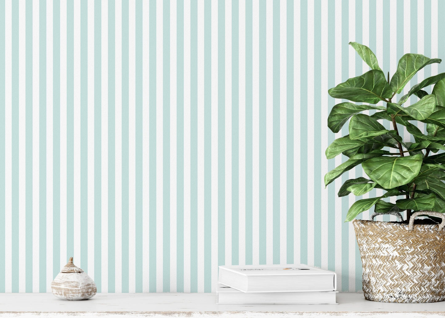 Vertical striped wallpaper behind a potted plant on a white shelf.