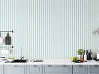 Wide turquoise and white vertical stripe wallpaper in a modern kitchen setting.