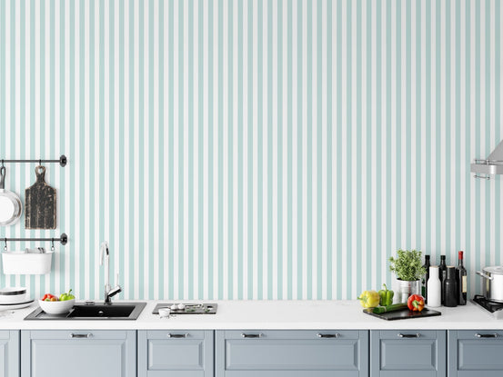 Wide turquoise and white vertical stripe wallpaper in a modern kitchen setting.