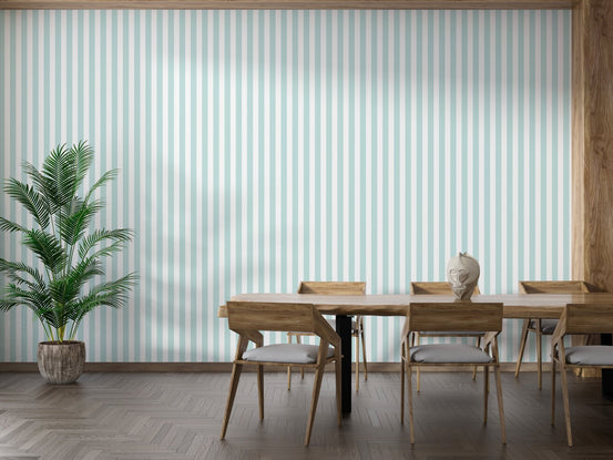 Minimalist dining room featuring wide turquoise stripe wallpaper and wooden furniture.
