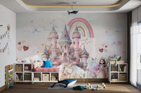 Pink towers princess castle unicorn rainbow wall mural in kids playroom.