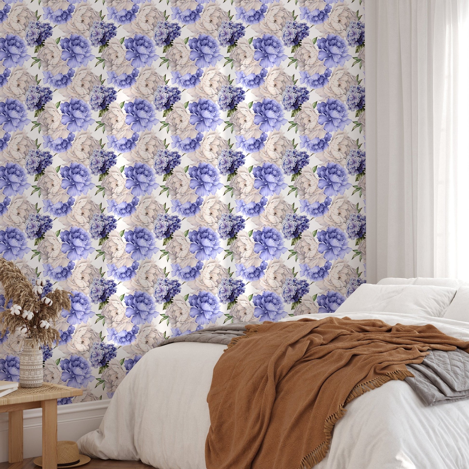 Purple peonies flower wallpaper in a bedroom with a brown throw blanket.