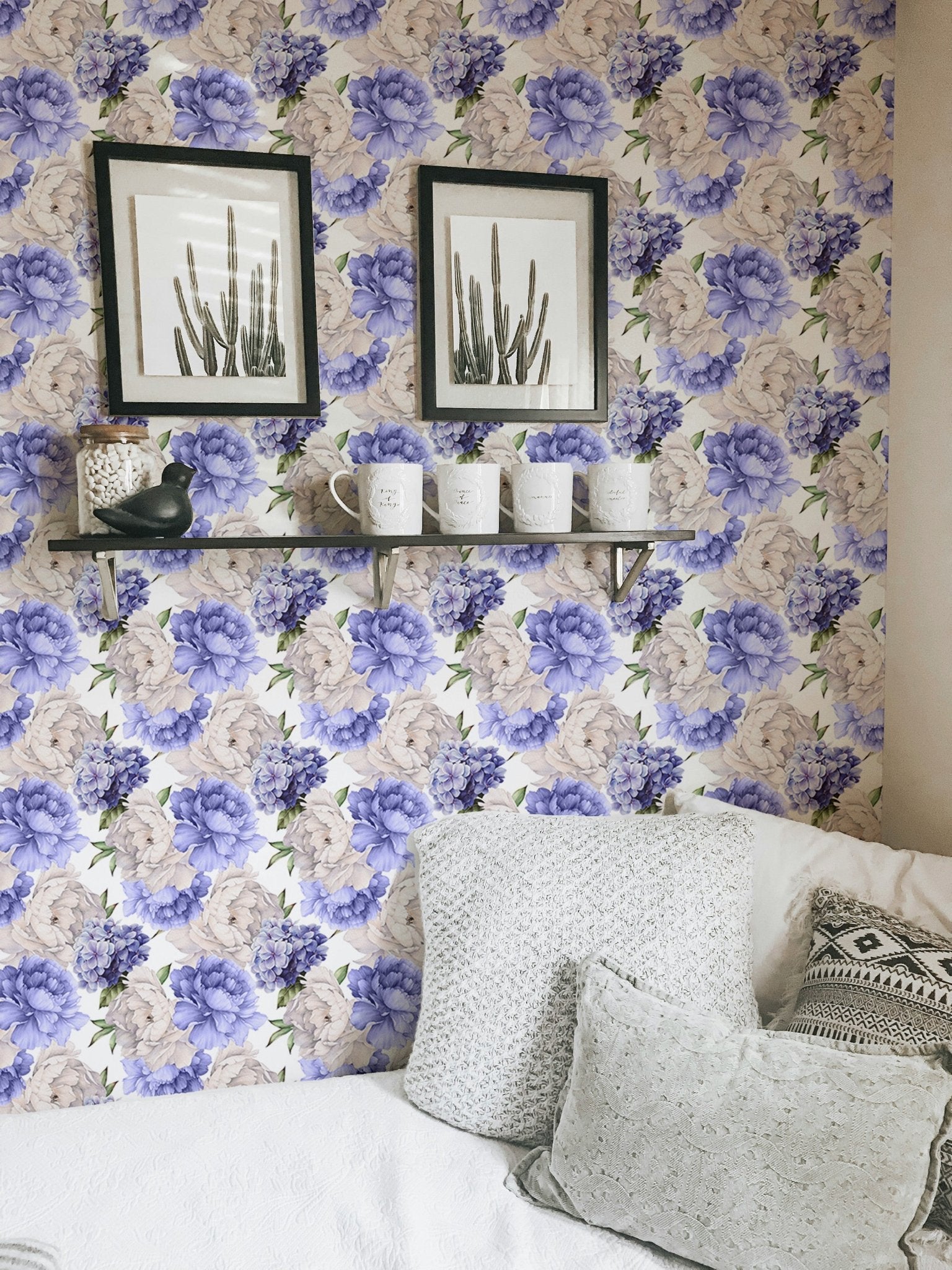 Peony flower pattern wallpaper in a small room with framed wall art.