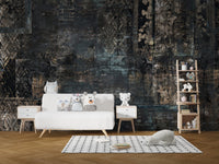 Nursery with dark distressed plaid wall mural and white furniture.