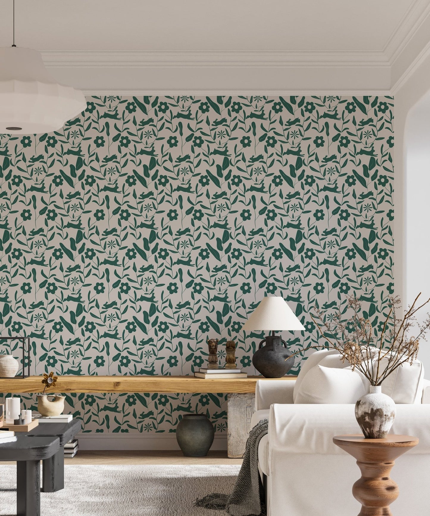Floral pattern wallpaper in a living room with a white sofa and floor lamp.