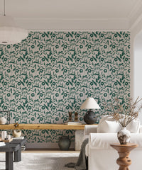 Floral pattern wallpaper in a living room with a white sofa and floor lamp.
