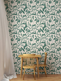 Scandinavian style wallpaper featuring green leaves in a small dining nook.