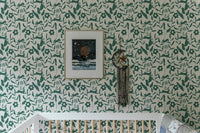 Rabbit Pattern Floral and Leaves Scandi Wallpaper in a nursery with a white crib.