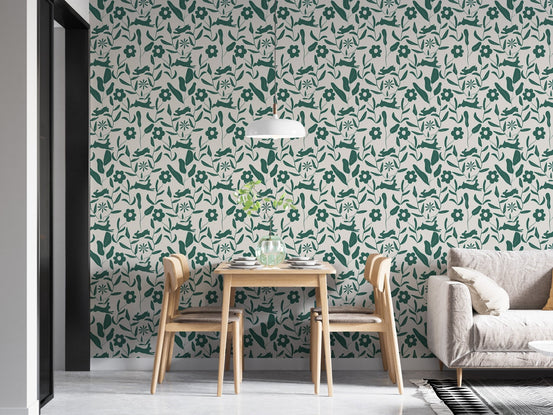 Floral and rabbit print wallpaper behind a wooden dining set and white pendant light.