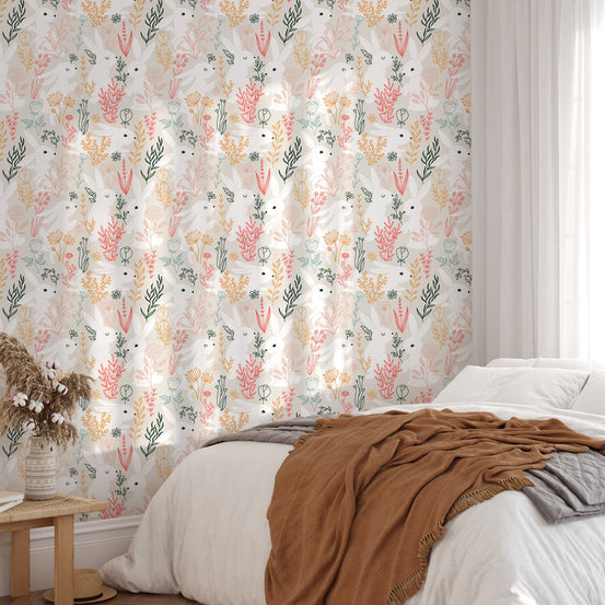 Guest bedroom featuring terracotta and green botanical rabbit wallpaper.