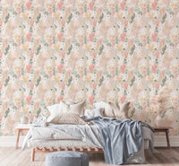 Low platform bed set against rabbit and leaf pattern wallpaper.