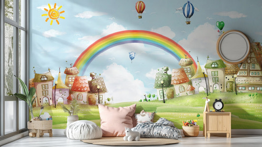 Colorful rainbow and balloons wall mural in a bright playroom with plush cushions.