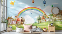 Colorful rainbow and balloons wall mural in a bright playroom with plush cushions.