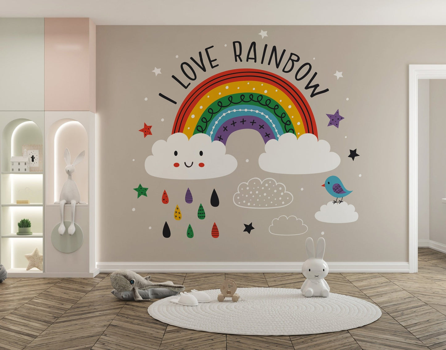 Play area featuring a colorful arch wall mural with "I Love Rainbow" text on a beige wall.