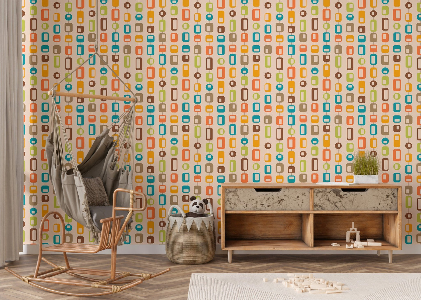 Nursery with rocking chair and colorful geometric vintage wall mural