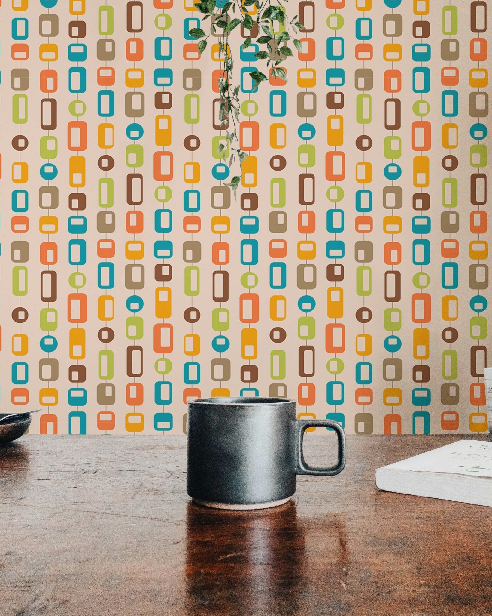 Dining table setting and vintage geometric pattern wall mural.