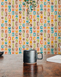 Dining table setting and vintage geometric pattern wall mural.