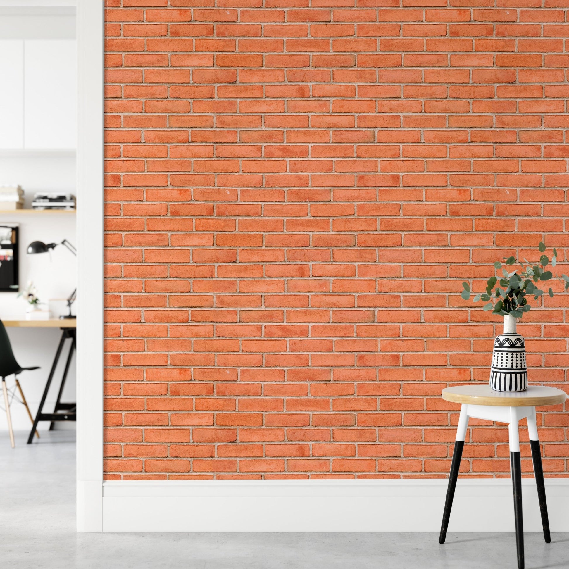 Faux red brick wallpaper on a hallway wall next to a small wooden table.